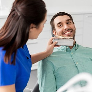 Patient smiling after teeth whitening in Centennial