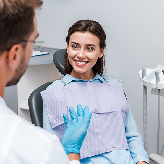 Patient smiling at dentist in treatment chair