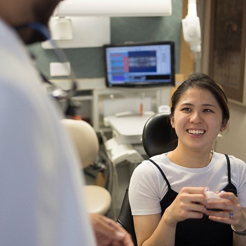 a patient talking to a dentist